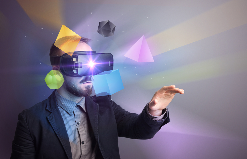 Amazed businessman with virtual reality colorful geometric shapes in front of him